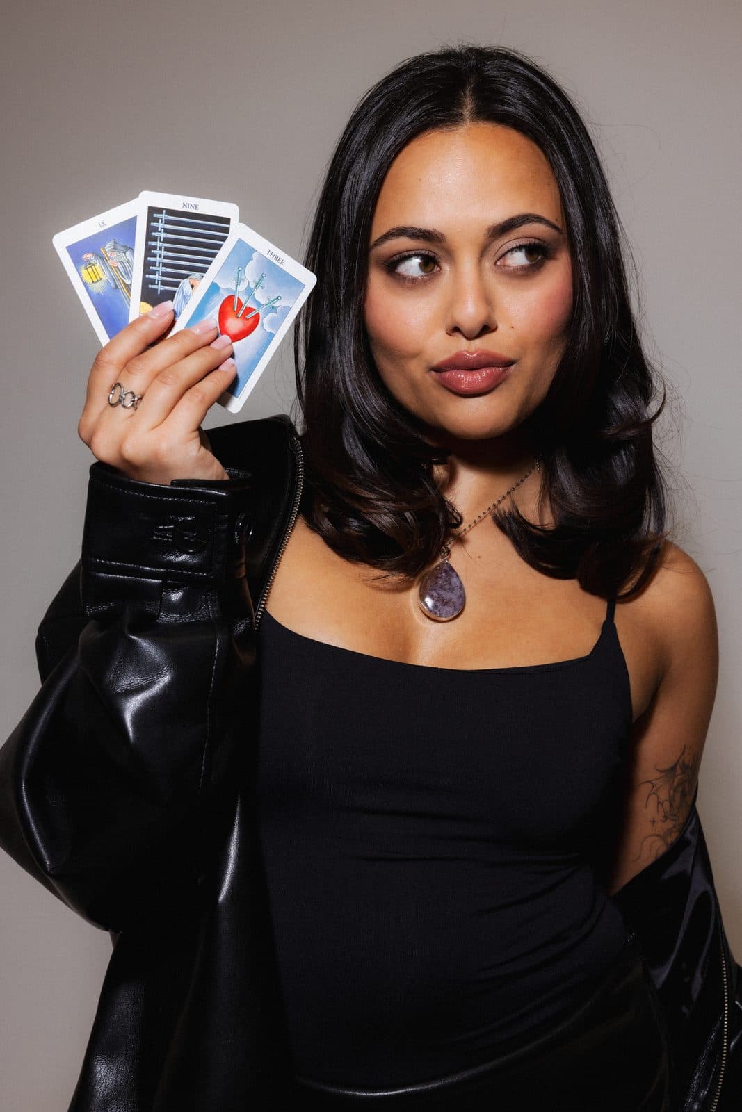 Soma holding tarot cards